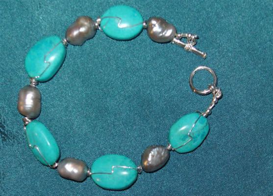 Bracelet Sterling silver wrapped turquoise with silver cultured freshwater pearls.